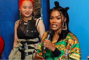 Teyana Taylor flashes her red acrylic nails.