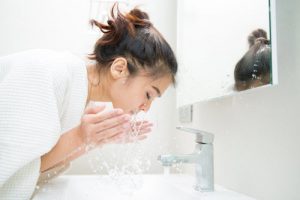 Girl washing face