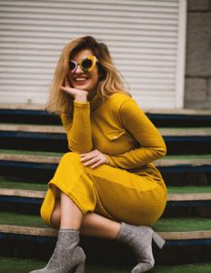 woman yellow long sleeve sunglasses