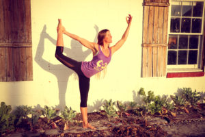 FEATURE IMAGE of WOMAN OUTSIDE DOING YOGA