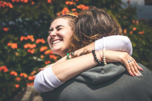 https://www.pexels.com/photo/smiling-woman-hugging-another-person-2292932/
