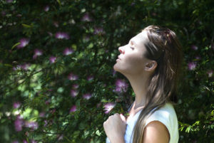https://www.pexels.com/photo/woman-closing-her-eyes-against-sun-light-standing-near-purple-petaled-flower-plant-321576/