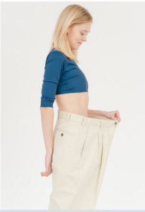 https://www.pexels.com/photo/cheerful-slender-woman-in-oversized-pants-6975488/