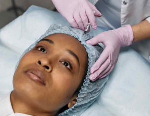 https://www.pexels.com/photo/dermatologist-injecting-botox-on-client-s-forehead-7581583/